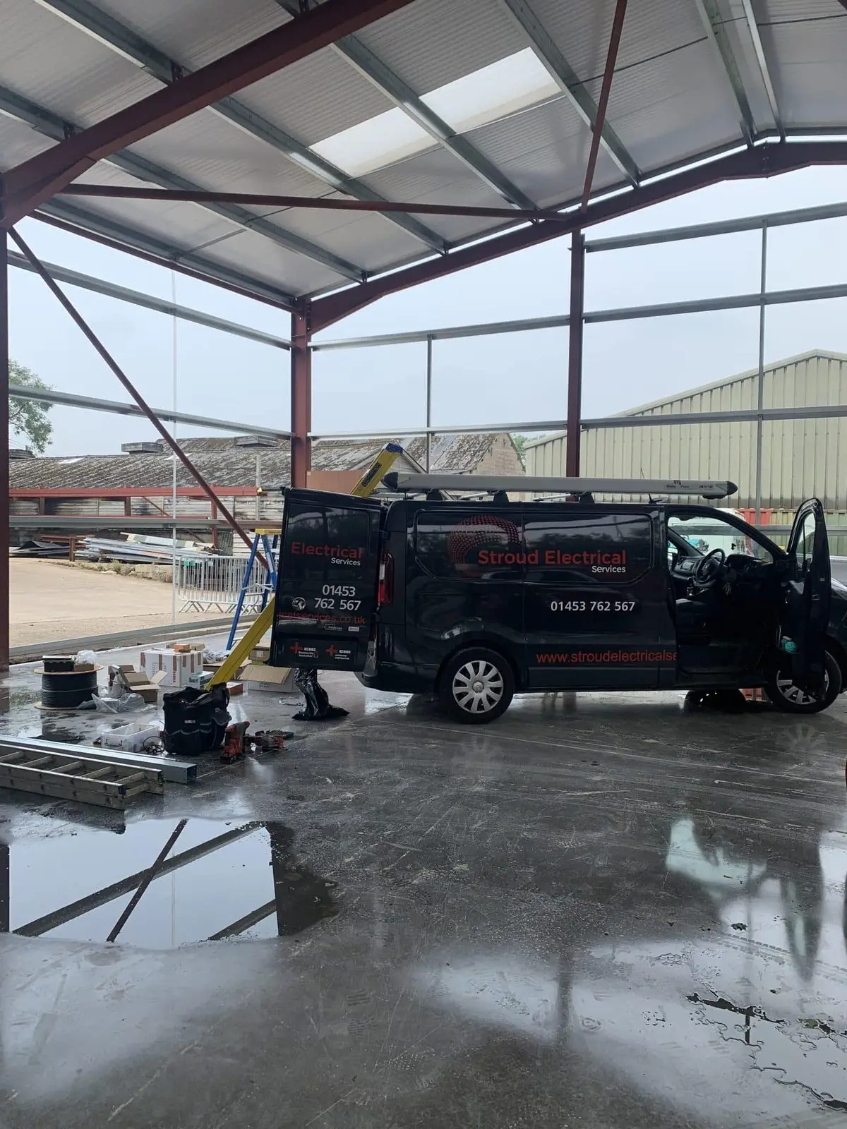 Industrial fluorescent and LED lighting in the Bisley Marquees workshop